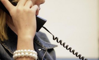 Gemeenten moeten inkoop Kindertelefoon regelen